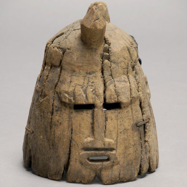 Dogon Mali Africa African art mask: DOGON helmet mask, Mali. Weathered wood with large metal staple repairs, stipr of native indigo dyed cloth at back. Height 10 3/4 inches. In good condition, weathered, eroded.