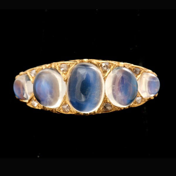 MOONSTONE, DIAMOND, 9K YELLOW GOLD RING.: MOONSTONE, DIAMOND, 9K YELLOW GOLD RING. Featuring five oval moonstone cabochons, weighing a total of approximately 4.25 cts., accented by eight rose-cut diamonds weighing a total of approximately 0.0