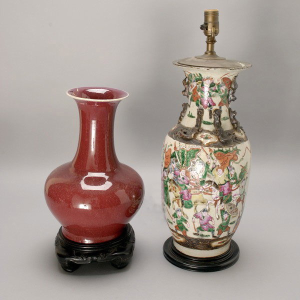 Two Chinese Ceramics: Two Chinese Ceramics, including a vase now mounted as a lamp and an ox blood glazed vase with matching wood stand {Tallest: 18 1/4 inches (46.3 cm)} Provenance: From the Estate of Douglas Hague and Jo