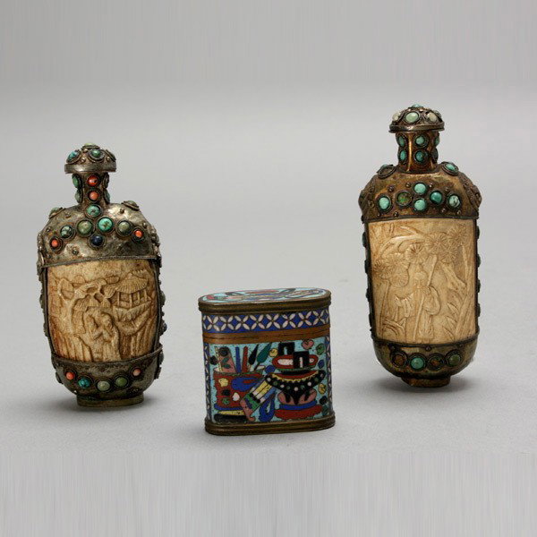 Two Mongol Snuff Bottles and a Small Cloisonné Box: Two Mongol Snuff Bottles and a Small Cloisonné Box, the snuff bottles with inlaid stones and carved plaques; the rounded rectangular box decorated with various vessels and objects {Tallest: 4 3/4 inc