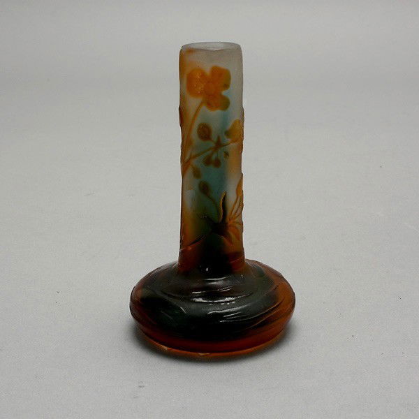 Gallé Cameo Glass Vase, circa 1910: Gallé Cameo Glass Vase, Circa 1910, of bottle form, cut with yellow shaded flowers on opalescent ground, with raised script signature Gallé. {Height 3 7/8 inches}