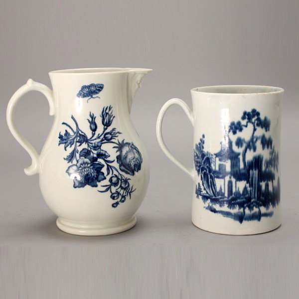 Worcester Porcelain Pitcher; and a Tankard: Worcester Porcelain Pitcher and a Tankard, the first of pear form, the exterior painted in underglaze blue with twin floral sprays and scattered butterflies, the spout with toby form mask, the auricul