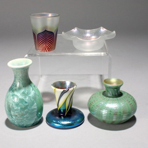 Five Miniature Glass Wares: Five Miniature Glass Wares: an iridescent shot glass, signed "Lundberg 83" (height 2 1/2 inches); a Steuben Verre de Soie ruffled rim nut dish, unsigned {diameter 3 3/4 inches}; an iridescent glass ca