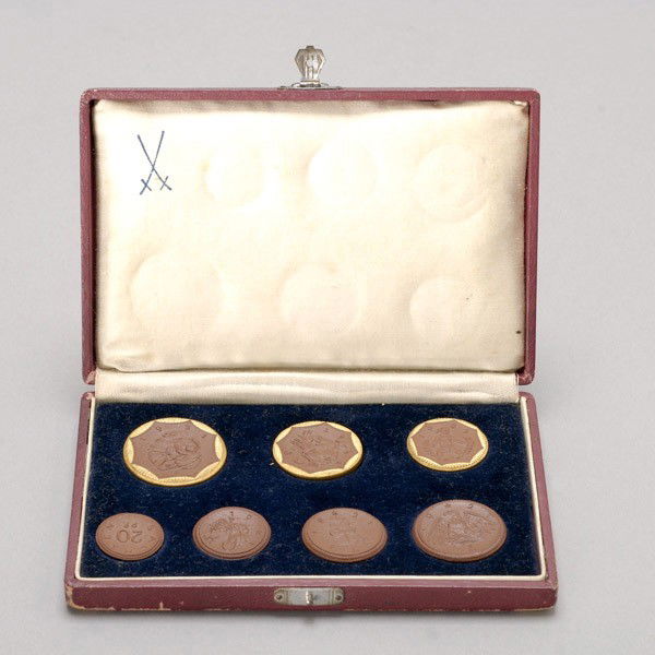 7 Meissen German Porcelain Coins in original box.: Set of seven Meissen German Porcelain Coins in original box. Provenance: From the Richard Smith Collection