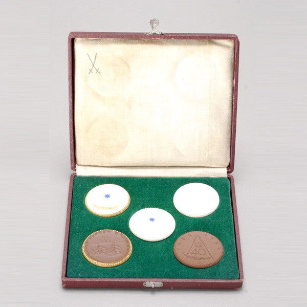 5 Meissen German Porcelain Coins in original box.: Set of five Meissen German Porcelain Coins in original box. Provenance: From the Richard Smith Collection