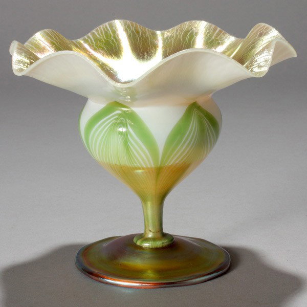Tiffany Studios White Floriform Dish: Tiffany Studios decorated floriform. White with gold interior and green pulled feather decoration dish, signed L.C.Tiffany Favrille 1500E {Height 5 3/4 inches, diameter 6 3/4 inches}