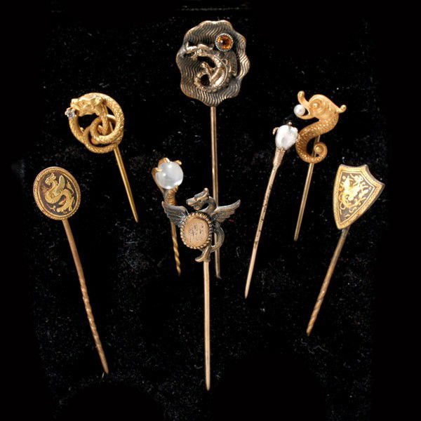 8 C/P, MNSTONE, 14K, 10K Y/G, GILT METAL STICKPINS.: COLLECTION OF EIGHT CULTURED PEARL, MOONSTONE, 14K, 10K YELLOW GOLD, GILT METAL DRAGON AND CLAW MOTIF STICKPINS. Including one 14k yellow gold, white stone coiled dragon stickpin, one yellow stone, me