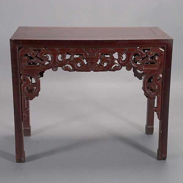 A Late Qing Dynasty Hongmu Side Table: A Hongmu Side Table, Late Qing Dynasty, the pieced rectangular table top supported by four plain square-section legs terminating in subtle hoof feet, the thick reticulated apron and spandrels of boldl