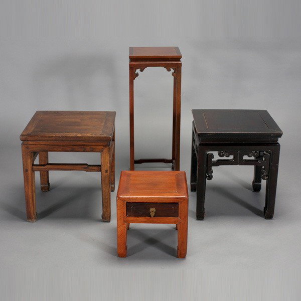 A Group of Four Stools and Display Stands: A Group of Four Stools and Display Stands, each of square form, the smallest with a drawer, all with a stylized or simply designed aprons {Tallest: 32 inches (81.3 cm)} [Overall wear]