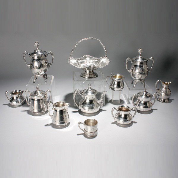 Group of Twelve Quadruple Plate Tablewares: Assembled Group of Twelve Quadruple Plate Tablewares: seven Meriden wares; and four Forbes pieces; together with a bride's basket {Height of basket 9 1/2 inches}