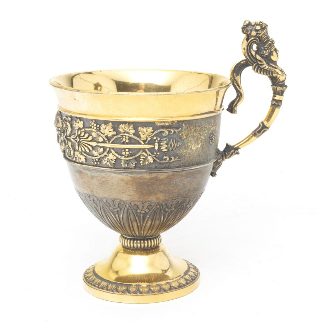 French Charles X Vermeil Cup in Case: French Charles X Vermeil Cup in Case. The cup with winged Minerva figural handle, chased grapevine motif band around the middle, tapered round foot; hardcase. Rubbing to markings, illegible; two marks