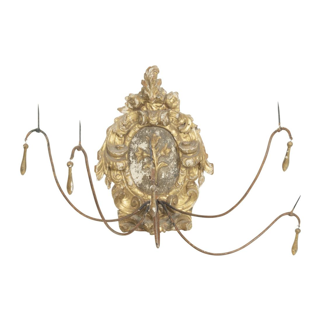 Baroque Giltwood Four Candlelight Sconce: Baroque Giltwood Four Candlelight Sconce The carved giltwood body with central floral sprig cartouche, within a scrolled foliate surround, five upswept arms with pricket sticks hung with giltwood drop