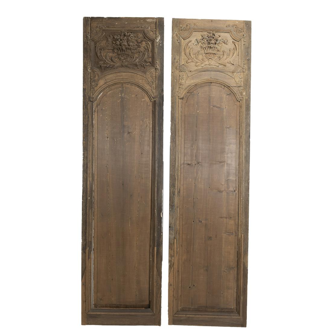 Pair of French Planche Oak Boiserie Panels: Pair of French Planche Oak Boiserie Panels. The carved panels with fruit baskets in relief to the tops, coffered panels; some slight variation in carving and wear. {Approximate dimensions: 89 1/2 high