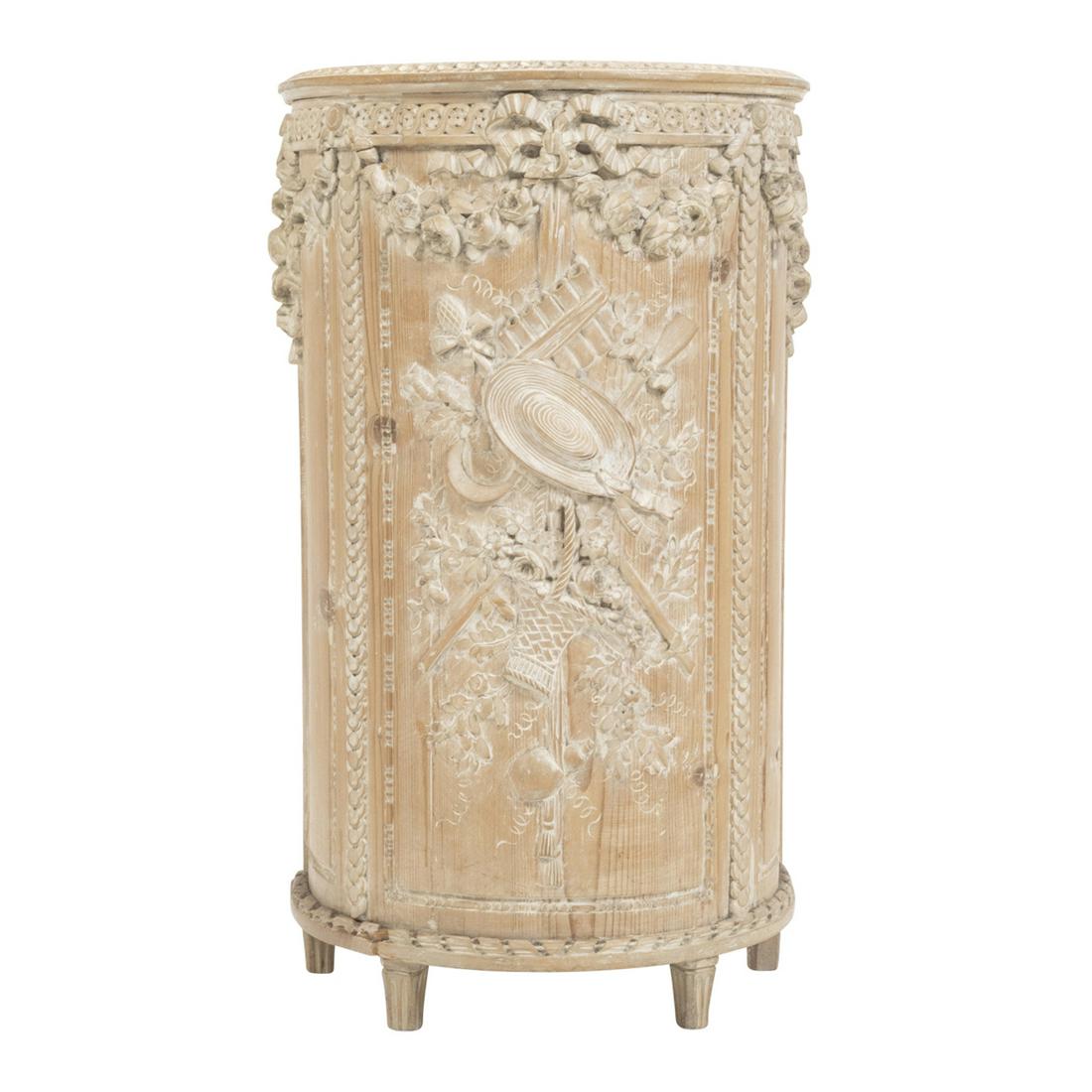 Louis XVI Limewood Demilune Umbrella Stand: Louis XVI Limewood Demilune Umbrella Stand. Carved in relief with floral garland hanging a grouping with floral basket, hat, pan flute, farming tools, etc.; metal insert. {Approximate dimensions: 26 1