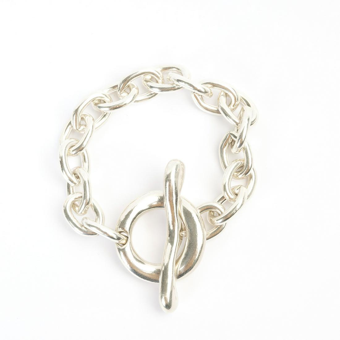 Robert Lee Morris Sterling Silver Bracelet.: Robert Lee Morris Sterling Silver Bracelet. The sterling silver open oval links measuring approximately 12 mm in width, completed by an oversized toggle clasp, forming a 7 1/2 inch bracelet. {Gross We