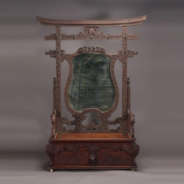 Chinese Export Two Piece Hall Tree with Mirror: Elaborately Carved Chinese Export Two Piece Hall Tree, First Quarter 20th Century, fashioned as a gate with dragon form supports holding the mirror on an trunk base {Dimensions 86 x 50 x 24 inches}