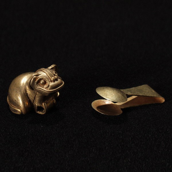 2 colombia or central america gold figures: Two COLOMBIA or CENTRAL AMERICA tumbaga items. A frog bell and tweezers. Tweezers 1 3/8 inches. Both in good condition. Provenance; Private collection, New York state. Purchased circa 1990 from James 