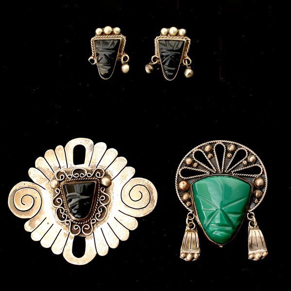 COLLECTION OF MEXICAN JEWELRY SUITE.: COLLECTION OF MEXICAN JEWELRY. Including one carved onyx mosaic, sterling silver brooch; matching pair of earrings together with a carved chalcedony mosaic, sterling silver brooch.