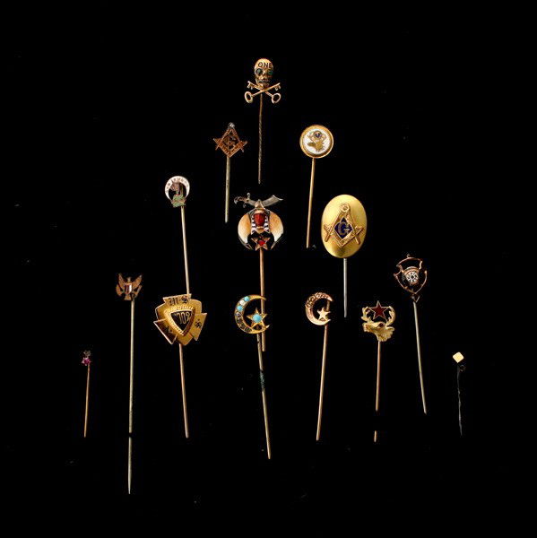 FOURTEEN 10K, METAL, G/F MASONIC/NOVELTY STICKPINS.: COLLECTION OF FOURTEEN 10K, METAL, GOLD-FILLED MASONIC AND NOVELTY STICK PINS. Including one 10k yellow gold metal skull and cross and bones pin, one 10k yellow gold moose head pin, one 10k gold oval