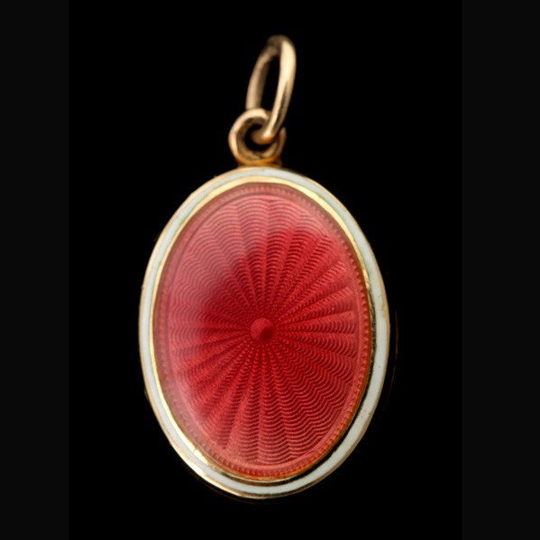 ENAMEL, 14K YELLOW GOLD LOCKET-PENDANT.: ENAMEL, 14K YELLOW GOLD LOCKET-PENDANT. Featuring pink sunburst guilloche enamel framed in white, set in a 14k yellow gold locket measuring approximately 18 x 14 x 4 mm, opening to reveal two locket c
