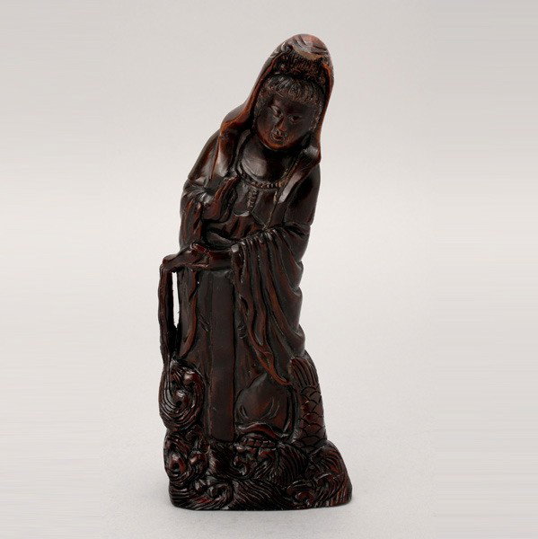 A Horn Carving of Guanyin: A Horn Carving of Guanyin, the Buddhist figure shown with a water bottle {Height: 9 3/4 inches (24.8 cm)}