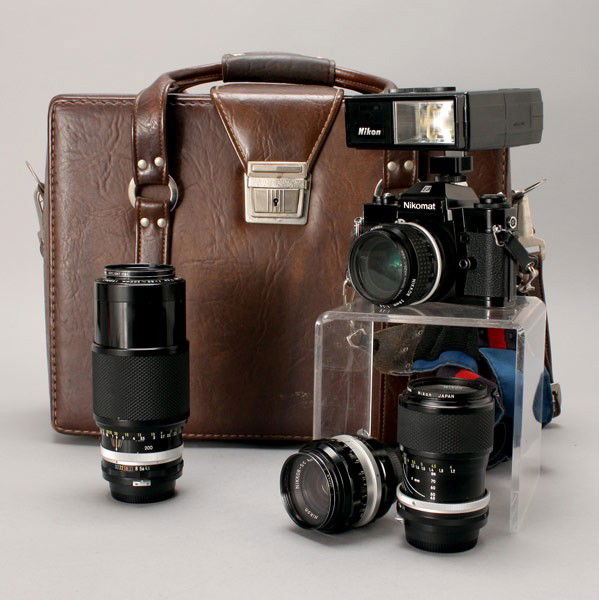 Nikon Cased Set: Nikomat Camera; Three Lens: Lot 677 Nikon Cased Set: Nikomat Camera; Three Lens; and a Flash: serial number on camera 5510292; model Nikomat EL; four lens: Nikkor 28 mm 1:2.8 481235; Zoom-Nikkor-C Auto 1:4.5 f=80-200mm 190067; N
