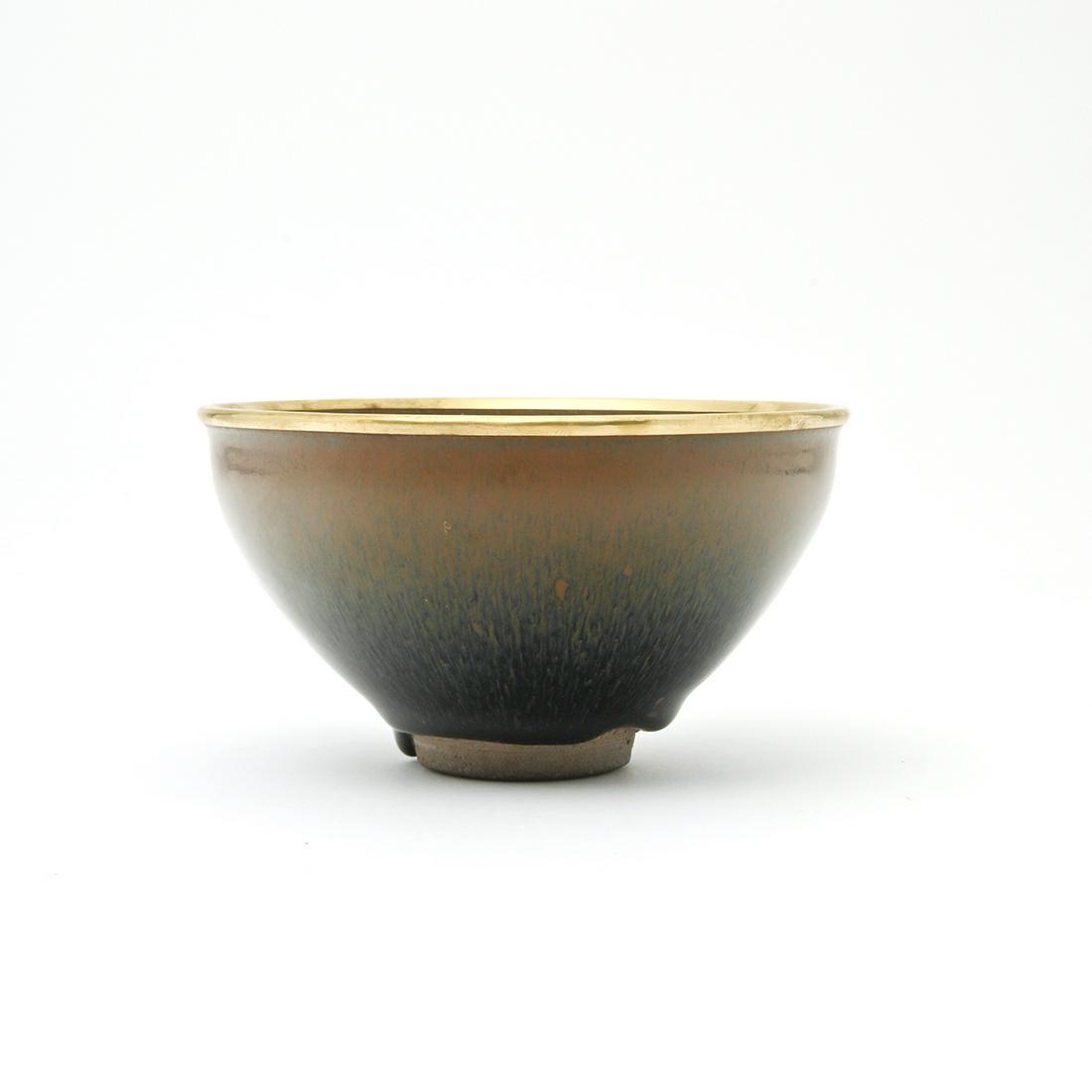 Chinese Fine Jian 'Hare's Fur' Tea Bowl: Chinese Fine Jian 'Hare's Fur' Tea Bowl. Finely potted with deep conical sides rising from a small foot to a shallow groove below the rim, covered with a rich black glaze suffused with fine russet 'ha