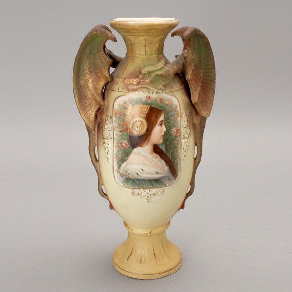 Austrian Art Nouveau Earthenware Urn: Austrian Art Nouveau Earthenware Urn The ivory ground bisque ovoid form modeled with griffin form handles, centering a profile portrait medallion of a crowned beauty with ermine collared robe, and rai