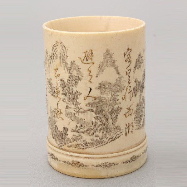 A Small Incised Ivory Brush Pot*: A Small Incised Ivory Brush Pot*, Incised with calligraphy and landscape and floral decorations, three seals to the sides and an incised four-character mark to the base, with wood stand. Republic Peri