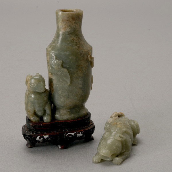 Two Jade Carvings: Two Jade Carvings, The first of a vase next to a mythical beast and three bats in flight; the second of lion-like mythical beast, both stones of mottled grayish color. Height of Vase Group: 4 inches (