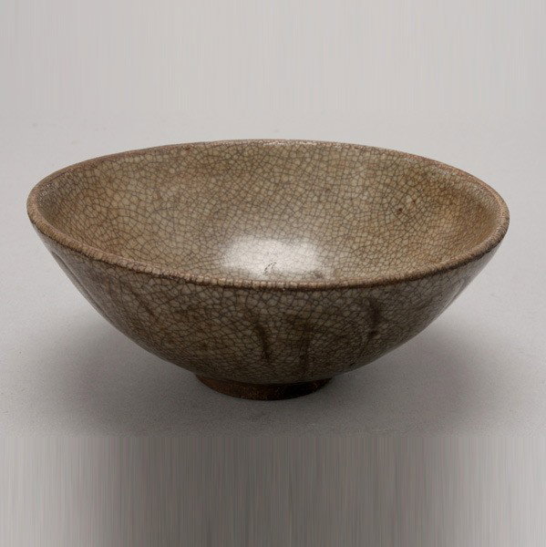 A Green-Glazed Lotus Bowl, 10th Century or Later: A Green-Glazed Lotus Bowl, Of steep rounded form, the bowl covered with green glaze displaying a dense russet-stained crazing web that stops short of the foot ring with a deeply recessed base, reveali