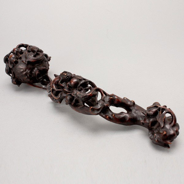 A Large Stained Boxwood Ruyi Scepter: A Large Stained Boxwood Ruyi Scepter, The scepter naturalistically carved as a fruiting pomegranate branch, the terminal formed as the pomegranate fruits with three chilongs, and the handle carved wit