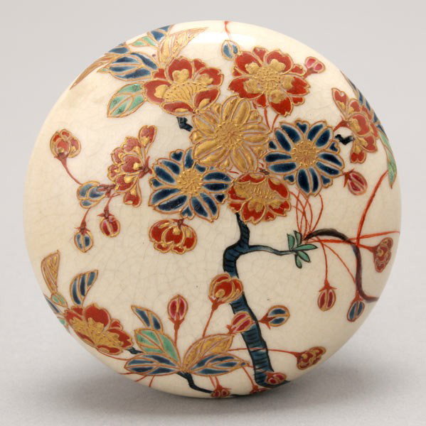 A Japanese Satsuma Ink Paste Covered Box, 19th C.: A Satsuma Ink Paste Covered Box, The exterior decorated with a tree in blossom with two more sprigs of flowers to the interior, mark and signature to base. 19th Century, Diameter: 3 inches (7.6 cm)