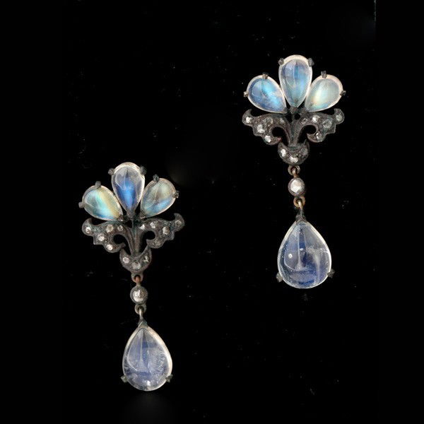 MOONSTONE, DIA., 14K Y/G, STERLING SILVER EARRINGS: PAIR OF MOONSTONE, DIAMOND, 14K YELLOW GOLD, STERLING SILVER EARRINGS. Each features four pear-shaped moonstone cabochons weighing a total of approximately 4.50 cts., accented by fourteen rose-cut dia