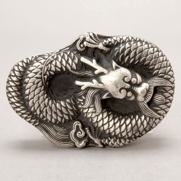 An White Metal Ink Well and Lid: An White Metal Ink Well and Lid, in the form of a recumbent dragon, a stylized seal character to the interior {Width: 5 1/4 inches (13.4 cm)}