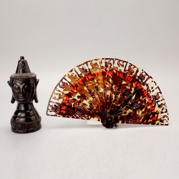 A Horn Buddha Head and a Tortoise Shell Fan*: Two Carvings*, the first a carved horn Buddha head, the second a tortoise shell folding fan {Height of Head: 8 inches (20.3 cm)}