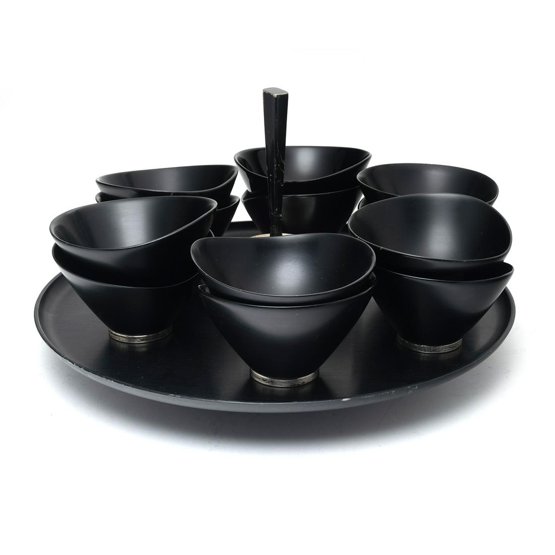 Mid Century Richard Hudson for Revere Salad Set: Mid Century Richard Hudson for Revere Ebonized Sterling Mounted Salad Set. Ebonized finish with silver mounts; comprising spinning tray on foot and eight salad bowls; the bowls with sterling silver fe