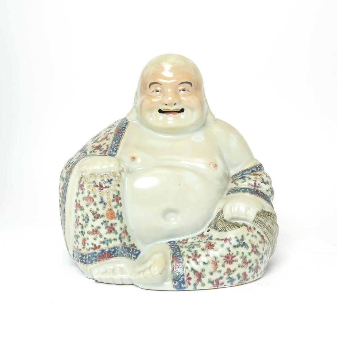 Chinese Famille Rose Porcelain Buddha: Chinese Famille Rose Porcelain Buddha. Depicting a happy Buddha with elongated ears in a seated pose, holding prayer beads and bag of plenty, with enameled flowering robes, an incised six-character ma