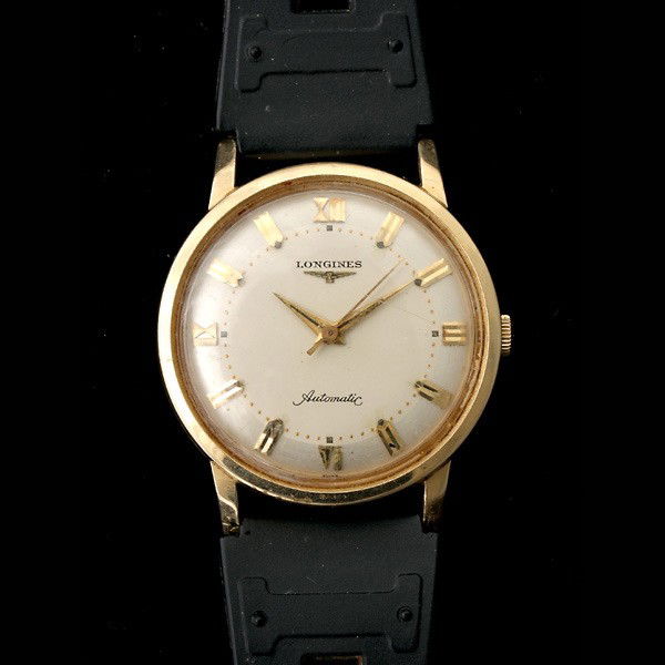 LONGINES 14K YELLOW GOLD WRISTWATCH.: LONGINES 14K YELLOW GOLD WRISTWATCH. DIAL: Round, textured and polished, applied gold tone Roman numerals and baton hour markers, pitched gold tone arrow hands, center sweep seconds hand, Longines, au