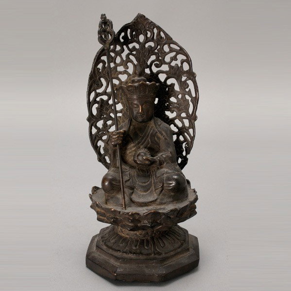 A Bronze Figure of a Buddhist Monk, Qing Dynasty: A Bronze Figure of a Buddhist Monk, Qing Dynasty, cast possibly as the legendary Tang dynasty Buddhist monk Xuanzang in meditation and seated on a lotus-form platform {Height: 10 1/8 inches (25.7 cm)}