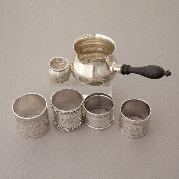 Sterling Group: a brandy warming pan; napkin rings: Sterling Group: a brandy warming pan with turned wood handle; three napkin rings, one by Gorham #1532; a second by Shiebler, a third marked Denmark 925S; together with two plated napkin rings (6) {Tot