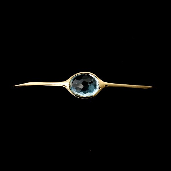 IPPOLITA TOPAZ, 18K YELLOW GOLD BANGLE BRACELET.: IPPOLITA TOPAZ, 18K YELLOW GOLD BANGLE BRACELET. The "Modern Rock Candy Two Stone" bracelet features two oval faceted blue topaz, bezel set in 18k yellow gold. Signed Ippolita. 6.80 dwts