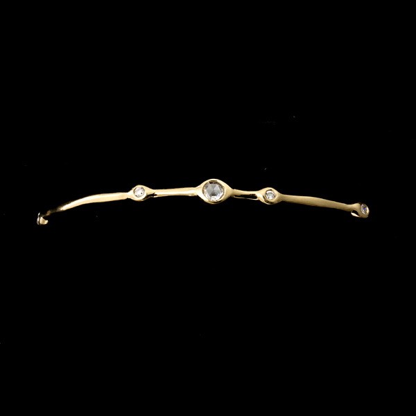 IPPOLITA DIAMOND, 18K YELLOW GOLD BANGLE BRACELET.: IPPOLITA DIAMOND, 18K YELLOW GOLD BANGLE BRACELET. The "Nine Stone" bracelet features one rose-cut and eight full-cut diamonds weighing a total of approximately 0.40 ct., bezel set in 18k yellow gold.