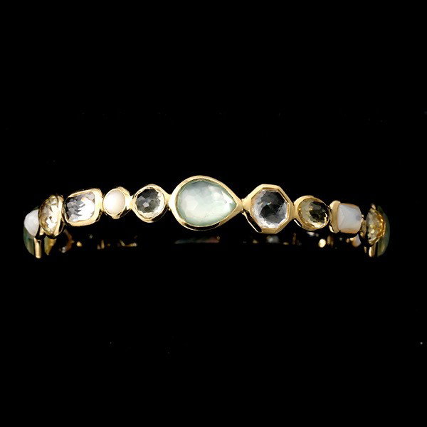 IPPOLITA MOTHER-OF-PEARL, QUARTZ GELATO BANGLE.: IPPOLITA MOTHER-OF-PEARL, QUARTZ GELATO BANGLE. The "Gelato" bangle features mother-of-pearl, topaz, quartz, bezel set in 18k yellow gold. Signed Ippolita. 12.10 dwts