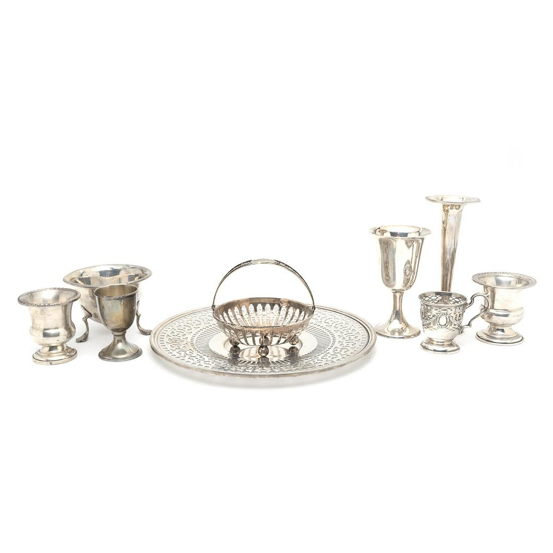 Sterling Silver Table Articles Including a Wallace Dish: Sterling Silver Table Articles Including a Wallace Pierced Dish. Comprising the pierced Wallace dish, American small three footed bowl, Whiting basket lacking insert, Durgin egg cup lacking insert, 2