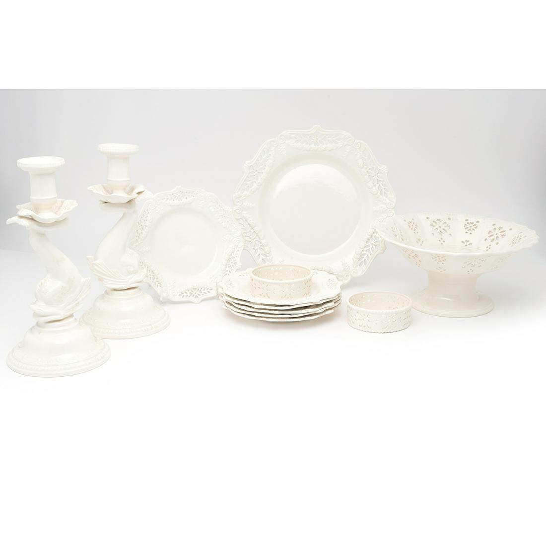 Twelve Leeds Pottery Creamware Table Articles: Twelve Leeds Pottery Creamware Table Articles. Comprising: a pair of dolphin-form figural candlesticks, a pair of wine coasters, a footed compote, six dessert plates and a serving dish. The candlestic