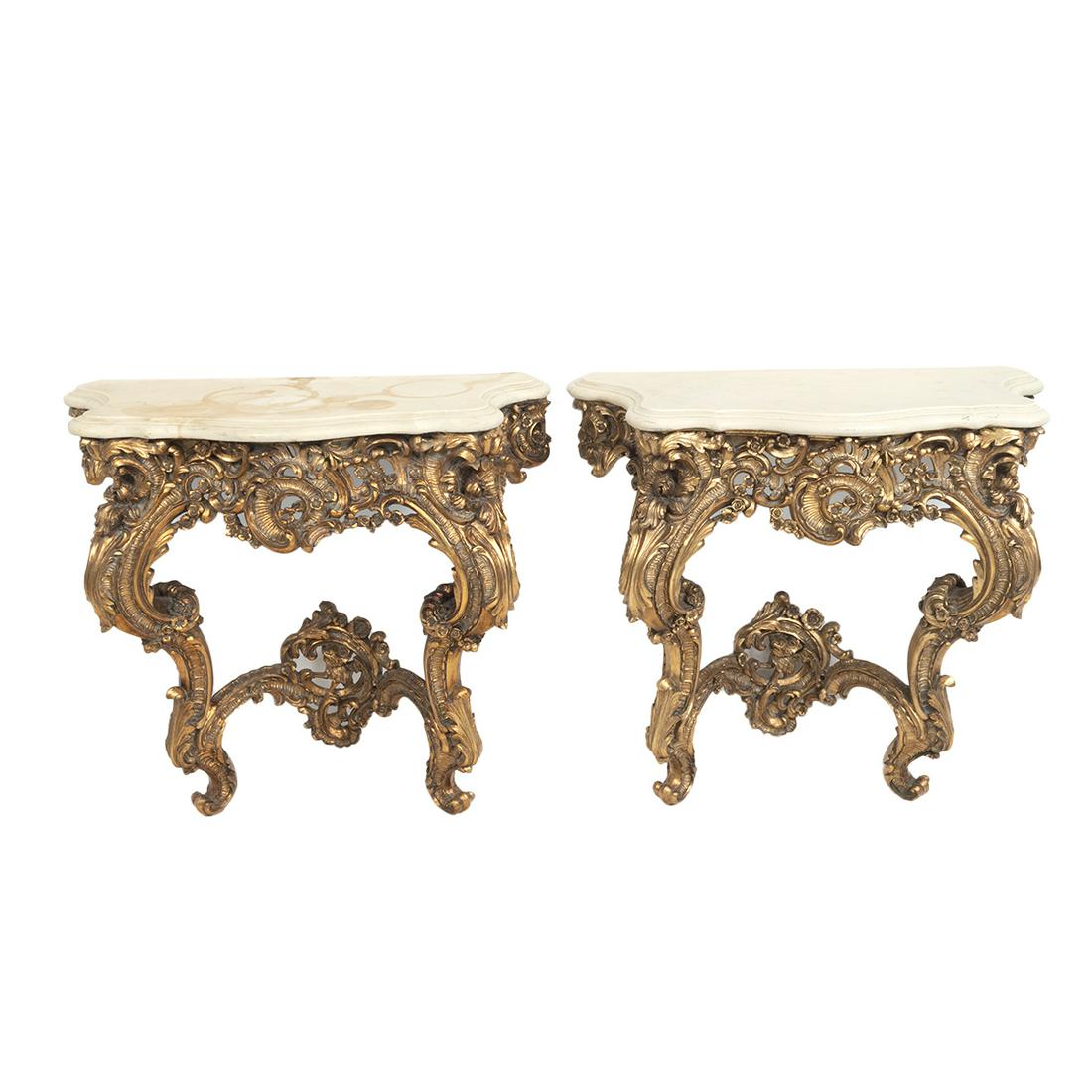Pair of Louis XV Style Gilt Consoles: Pair of Louis XV Style Gilt Consoles. Fiberglass bodies and tops, the top with white marble style finish, the base with patinated gilt finish. {Approximate dimensions: 30 1/2 high x 33 wide x 14 1/2 i