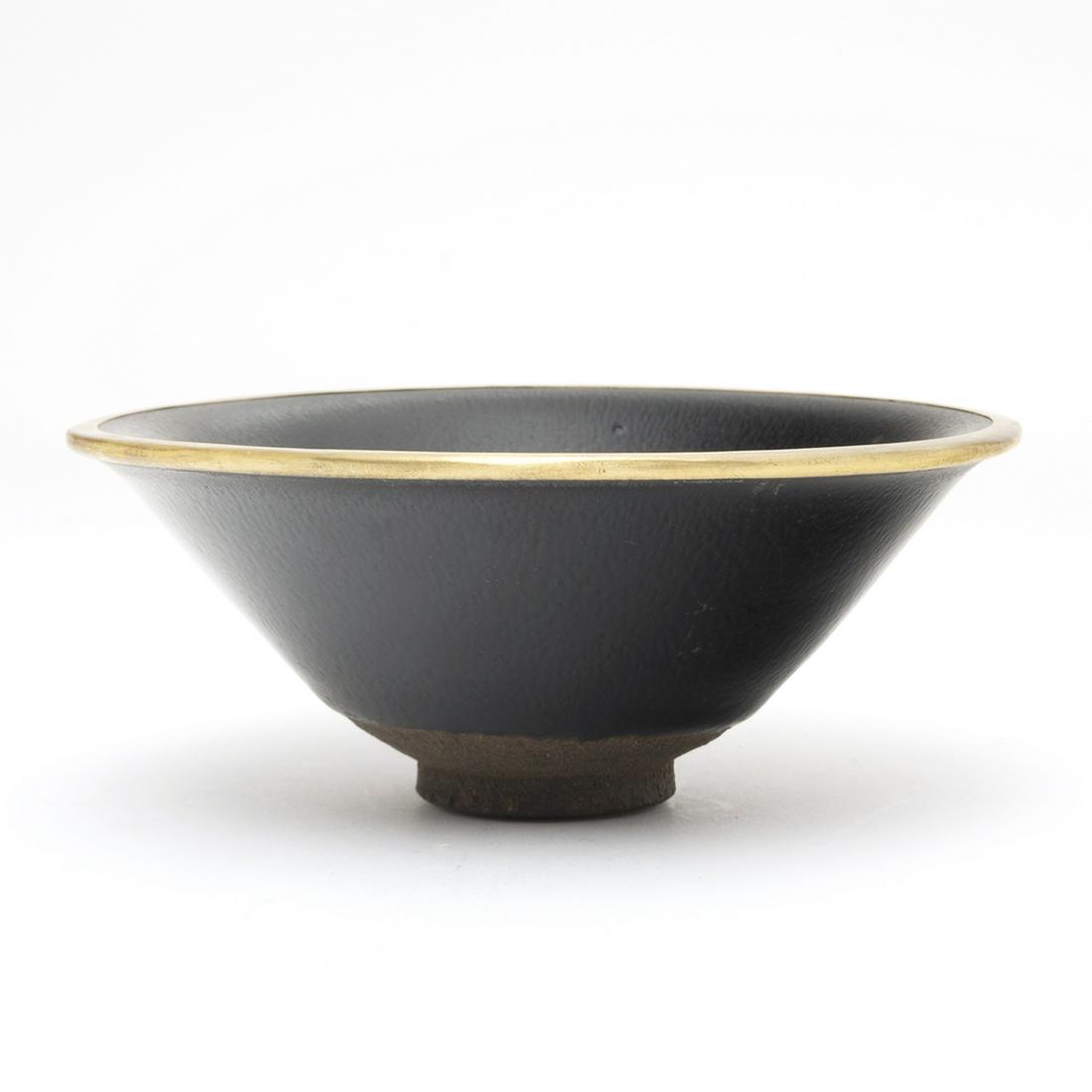 Chinese Jian Silver 'Hare's Fur' Tea Bowl: Chinese Jian Silver 'Hare's Fur' Tea Bowl. Of deep conical sides rising from a small foot to a flared mouth rim, covered inside and out with a black glaze finely streaked with silvery-brown 'hare's fu