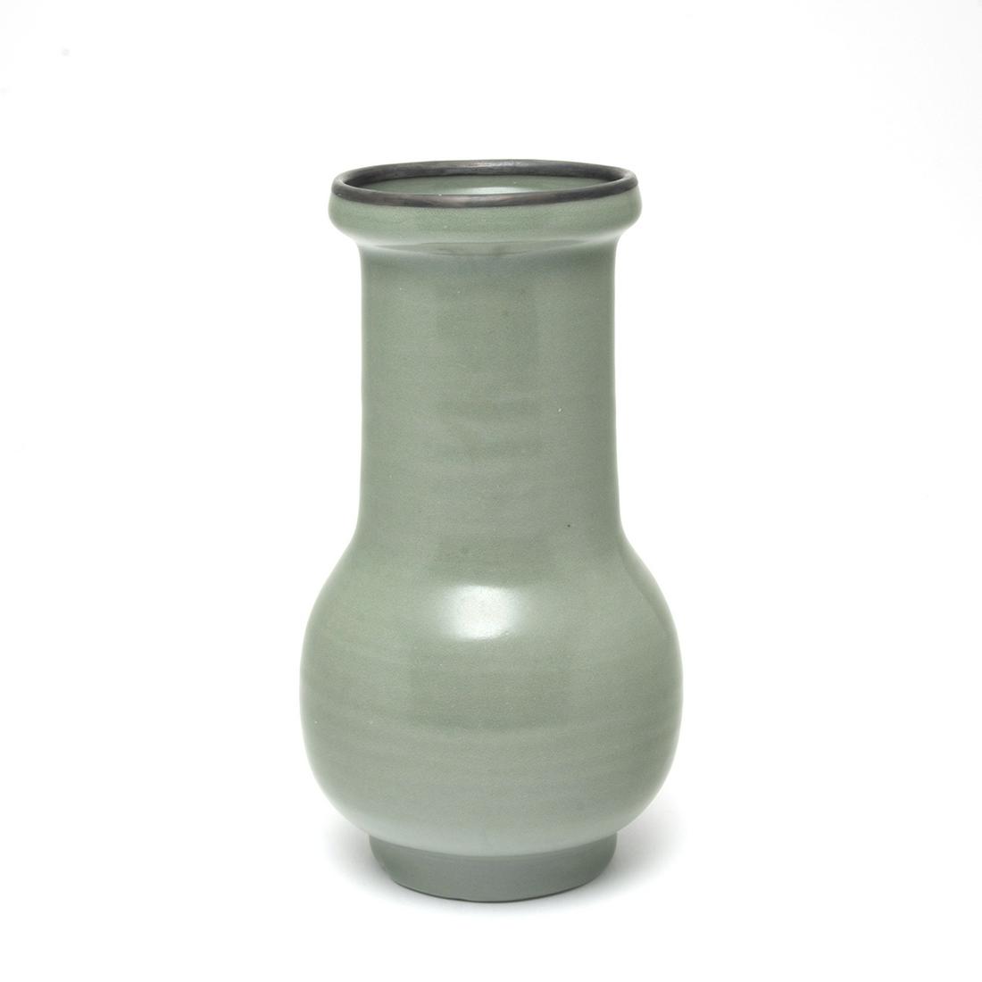 Chinese Longquan Celadon Vase: Chinese Longquan Celadon Vase. Of ovoid form rising from a tapered foot to a wide cylindrical neck with an upturned mouth rim, covered overall with a lustrous olive-green glaze, the rim bound in a met