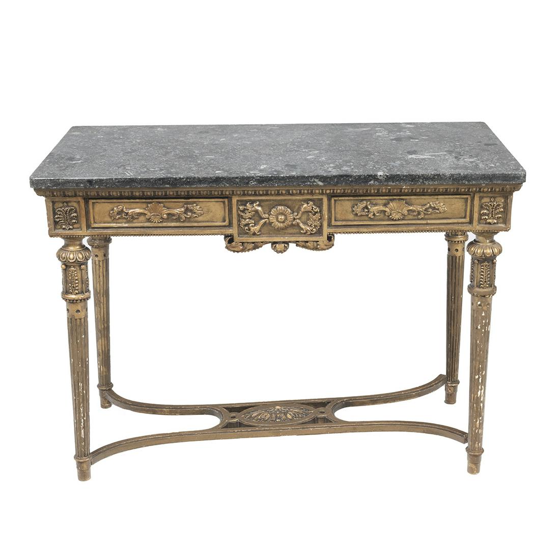 Louis XVI Style Giltwood Table, Black Fossil Marble Top: Louis XVI Style Giltwood Table, Black Fossil Marble Top. Carved decoration, the top resting on four round tapered fluted legs with stretcher. {Approximate dimensions: 27 1/4 high x 38 wide x 19 1/2 in